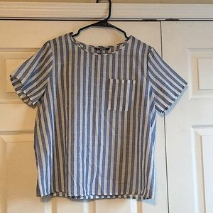 Blue and white striped shirt, buttons in the back.